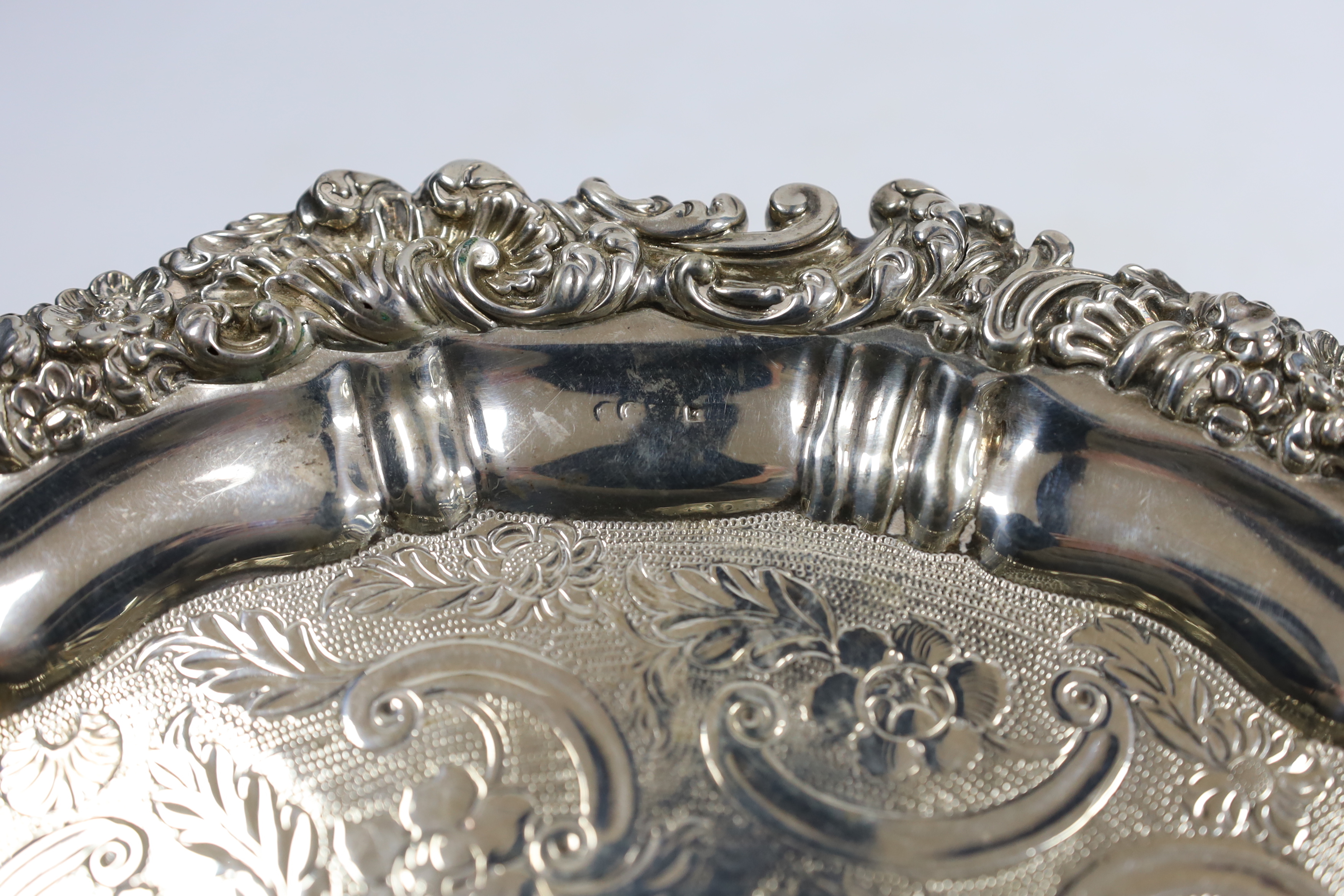 An early 19th century engraved silver salver, marks rubbed, 30.8cm, 26oz.
